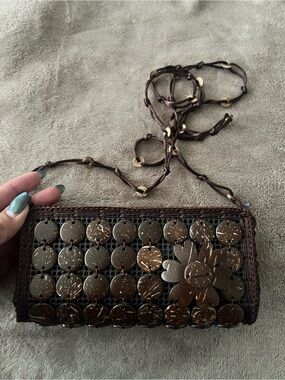 Woven Coconut Disc Crossbody Bag in Dark Brown